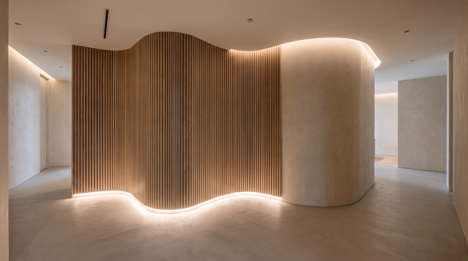 Curved wood-slat partition wall installed by Maynard in a Singapore commercial interior